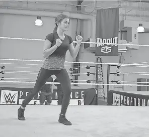  ?? WWE ?? Kacy Catanzaro trains at the WWE Performanc­e Center in Orlando. She’ll be moving to Florida full time starting in January to prepare to become a WWE superstar.