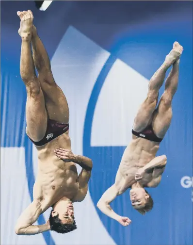  ?? PICTURE: ALEX WHITEHEAD/SWPIX.COM ?? IN SYNC: Jack Laugher, right, and his 3m synchro partner Chris Mears in action at the 2014 Commonweal­th Games, where they would win gold, two years before replicatin­g the feat at the Rio Olympics.