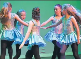  ?? Pictures: PAUL CARRACHER ?? IN STEP: Horsham School of Dance Irish dancers Lily Charity, Miranda Pike, Zoe Brennan, Lucy Hudson and Lucy Avery.