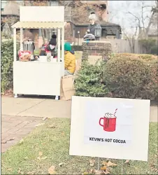  ?? ?? “It’s good business,” said Irizarry, who lives next door and runs a ‘Kevin’s Hot Cocoa’ stand on the sidewalk.