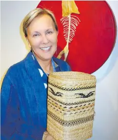  ??  ?? Spuzzum First Nation member and Emily Carr University professor Brenda Crabtree showed a basket and one of four deer-hide drums she crafted.