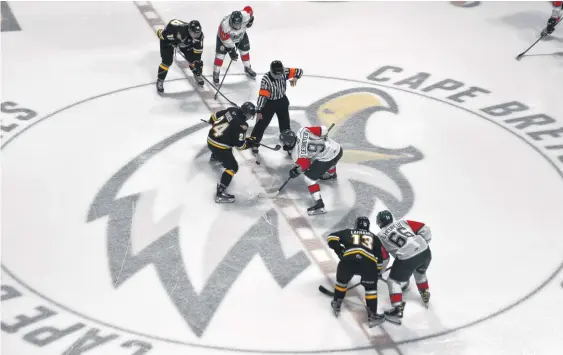  ?? JEREMY FRASER • CAPE BRETON POST ?? Ryan Francis of the Cape Breton Eagles, left, and Elliot Desnoyers of the Halifax Mooseheads take a faceoff to begin the second period of their QMJHL regular season opener on Oct. 2 at Centre 200 in Sydney. If the QMJHL decides to have a bubble location in the Maritimes, Sydney would be an ideal fit for many reasons.