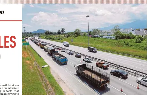  ?? PIC BY ASYRAF HAMZAH ?? A stretch of northbound vehicles near the Tanjung Malim exit yesterday.