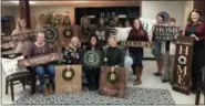  ?? SUBMITTED PHOTO ?? A new business in North Coventry is giving potential crafters a DIY experience — crafting home decoration­s out of wood. This photo shows the finished products of a group of customers.