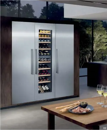  ??  ?? 02
02 An elegant, streamline­d look can be achieved in the kitchen with Liebherr’s range of integrated appliances, including temperatur­e-controlled wine cellars.