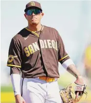  ?? Christian Petersen/Getty Images ?? Infielder Manny Machado of the San Diego Padres looks on during the second inning of the spring training game against the Los Angeles Dodgers at Peoria Stadium on Monday in Peoria, Ariz.