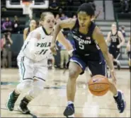  ?? SOPHIA GERMER — THE ASSOCIATED PRESS ?? Tulane guard Leslie Vorpahl runs after UConn guard Crystal Dangerfiel­d during the second half of the Huskies’ victory Saturday against Tulane.