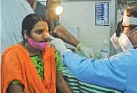  ?? — DEEPAK DESHPANDE ?? (Top) People sit in close proximity for a check-up at the ENT Hospital, without maintainin­g physical distance on Friday.
Doctor checks a woman for black fungus at the ENT Hospital, in Hyderabad on Friday.