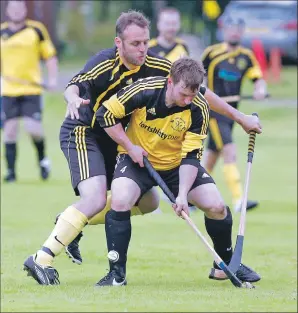  ?? Photos: Stephen Lawson ?? Inveraray’s Euan McMurdo puts pressure on Sean Cruickshan­k of Fort William.