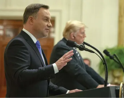  ?? (Tasos Katopodis/Sipa USA/TNS) ?? PRESIDENT OF POLAND Andrzej Duda speaks as US President Donald Trump listens at a news conference in the White House last month.