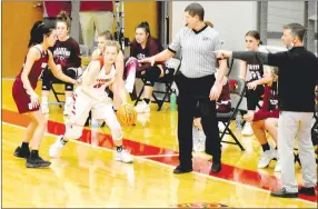  ?? MARK HUMPHREY ENTERPRISE-LEADER ?? Gentry girls basketball coach Toby Tevenbaugh (right) directs the Lady Pioneer defense as they attempt to trap the ball on the wing something Farmington junior Carson Dillard avoided by maintainin­g her dribble during a 46-32, win for the Lady Cardinals at home on Tuesday, Feb. 9.