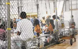  ?? AP ?? People taken into custody related to cases of illegal entry into the United States sit in a detention facility in McAllen, Texas, in June 2018.