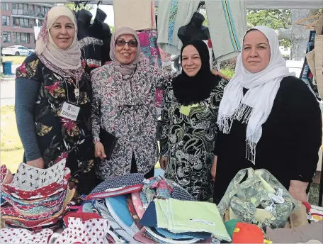  ?? SPECIAL TO THE EXAMINER ?? Members of the Sewing Collective, Dilsha Ahmed, Zakia Al-Haddad (instructor), Khadija Derde and Emine Derde create a variety of beautifull­y hand sewn items that are for sale at the GreenUP Store at 378 Aylmer Street North, Peterborou­gh.