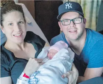  ?? ADRIAN LAM, TIMES COLONIST ?? Elaine and Rob Tuit with the region’s first baby of the new year, Hallie Rae Tuit, at Victoria General Hospital.