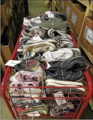  ?? PHOTO COURTESY OF RON MILLER ?? Sneakers of all sizes, makes and styles will be delivered to Texas flood victims on Labor Day by the North Coventryba­sed charity In Ian’s Boots.