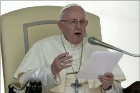  ?? ANDREW MEDICHINI — THE ASSOCIATED PRESS ?? Pope Francis gives his speech during his weekly general audience, at the Vatican, Wednesday.