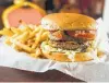  ?? Jake Daniels / /Beaumont Enterprise ?? Southern Double Burger with fries are on the menu at Sam’s Southern Eatery.