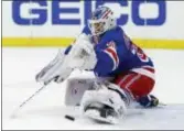  ?? THE ASSOCIATED PRESS ?? Rangers goaltender Henrik Lundqvist (30) of Sweden makes a save in the first period of Sunday’s game against the Flyers.