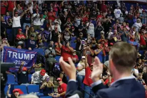  ?? The Associated Press ?? CAMPAIGN RALLY: President Donald Trump supporters cheer Eric Trump, the son of President Donald Trump, before a Trump campaign rally in Tulsa, Okla., on Saturday.