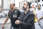  ?? ?? Police officers escort Adnan Oktar and others after their arrest, in Istanbul, Türkiye, July 19, 2018.