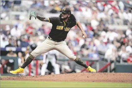  ?? AP PHOTO/BRYNN ANDERSON ?? San Diego Padres starting pitcher Sean Manaea delivers in the first inning of a baseball game against the Atlanta Braves, on Saturday in Atlanta.