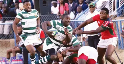  ??  ?? CHARGING SABLE . . . Zimbabwe’s Tafadzwa Kamandiro streaks away with the ball during the Sables match against the Kenyan Simbas in Bulawayo on Saturday — (Picture courtesy of Sunday News)