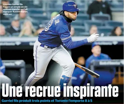  ?? PHOTO AFP ?? Lourdes Gurriel fils frappe un simple en cinquième manche qui fait marquer Russell Martin.