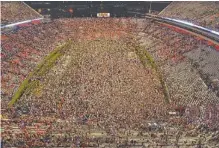  ?? AUBURN PHOTO BY TODD VAN EMST ?? Auburn fans have stormed the field at Jordan-Hare Stadium three of the last four times the Tigers have hosted Alabama, including after this 48-45 triumph two years ago.