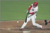  ?? AARON DOSTER — THE ASSOCIATED PRESS ?? The Cincinnati Reds’ Shogo Akiyama hits a single during the fourth inning Friday against the Chicago White Sox in Cincinnati.