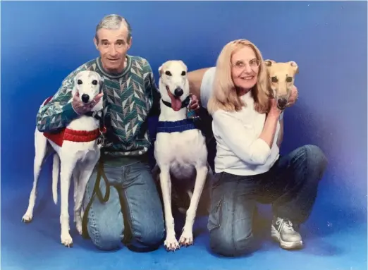  ?? PROVIDED ?? Paul and Toni Schultz with some of the many greyhounds who became part of their household (from left): Comet, Bear and A.D., short for Artful Dodger.