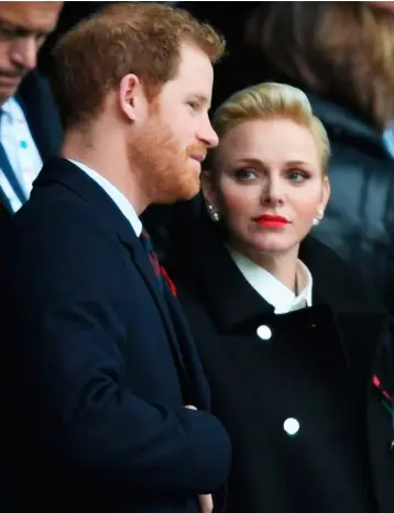  ??  ?? SINGLED OUT: Prince Harry was seen with Charlene, Princess of Monaco, in the stands during the match at Twickenham, London, and not his new girlfriend, Meghan. Photo: Mike Egerton/PA Wire