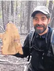  ?? COURTESY PHOTO ?? Ellis Margolis, a researcher with the U.S. Geological Survey, displays a tree-ring sample in the Jemez Mountains. Margolis is part of a team studying the fire history of forests near Taos.