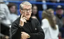  ?? CLOE POISSON/HARTFORD COURANT VIA AP ?? UConn head coach Geno Auriemma directs his team Wednesday in Hartford, Conn., during the victory over Seton Hall. Only two other Division I coaches have 1,200 wins.