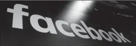 ?? Richard Drew/AP ?? Facebook: The logo for Facebook appears on screens at the Nasdaq MarketSite in New York's Times Square. Facebook made $40 billion in advertisin­g revenue last year, second only to Google when it comes to its share of the global digital advertisin­g market.