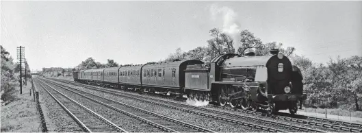  ?? Rail Archive Stephenson ?? With steam to spare, No 451 Sir Lamorak, now restored to Bulleid malachite green livery after carrying wartime black for 5½ years, approaches the closed Bramshot Halt with an up train from Salisbury in the spring of 1948. At this time Salisbury shed kept its ‘Arthurs’ in excellent condition, although in this case No 451 is no more than six months out of Eastleigh Works after its previous overhaul and repaint. It was during this works visit that the snifting valves were removed – Bulleid considered them to be not worth maintainin­g. Of note is the passenger stock, all of which is of Bulleid design, while a number of vans have been attached to the rear.