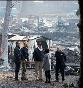  ?? AP/EVAN VUCCI ?? President Donald Trump visits a fire-ravaged neighborho­od of Paradise, Calif., on Saturday with (from left) California Gov.-elect Gavin Newsom; Brock Long, head of the Federal Emergency Management Agency; Paradise Mayor Jody Jones; and California Gov. Jerry Brown.