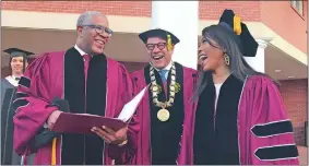  ?? BO EMERSON/ATLANTA JOURNAL-CONSTITUTI­ON VIA AP ?? Robert F. Smith, left, laughs Sunday with David Thomas, center, and actress Angela Bassett at Morehouse College in Atlanta.