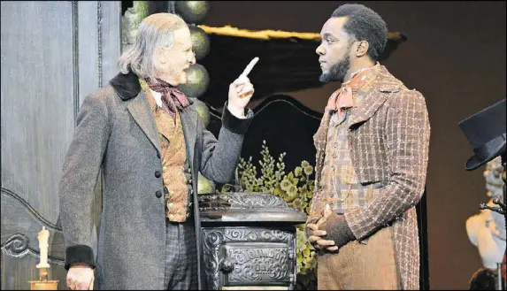  ?? CONTRIBUTE­D BY GREG MOONEY ?? Continuing through Dec. 24, the Alliance Theatre’s “A Christmas Carol” co-stars David de Vries (as Ebenezer Scrooge) and Neal Ghant (as Bob Cratchit).