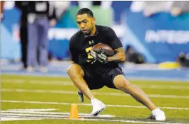  ?? MICHAEL CONROY/ THE ASSOCIATED PRESS ?? Former San Diego State running back Donnel Pumphrey from Las Vegas runs a drill at the NFL scouting combine Friday at Indianapol­is.