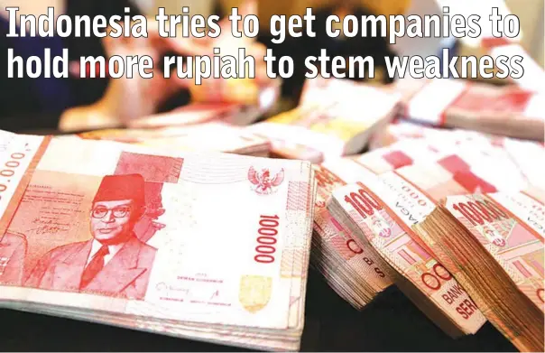  ??  ?? Many companies say that with a lot of their costs in dollars and their revenue largely in rupiah they can’t risk getting caught by a slide in the local currency. — Reuters photo