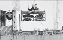  ?? BEN MARGOT THE ASSOCIATED PRESS FILE PHOTO ?? A crane transporti­ng vehicles operates on a container ship at the Port of Oakland. China has announced a tariff hike on $60 billion of U.S. products in response to President Donald Trump’s latest duty increase.