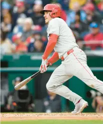  ?? NICK WASS/AP ?? The Phillies’ J.T. Realmuto in action against the Nationals on Saturday in Washington.