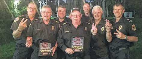  ?? CONTRIBUTE­D ?? Woods Harbour-Shag Harbour firefighte­rs, from left, Billy Kenney, Jody Goreham, Scott Bubar, Gordie Ross, Shannon Newell and Ricky Banks claimed second spot in Limited and Unlimited Pits’ challenges at the North American Vehicle Rescue Challenge in East Patchogue, New York. Also pictured is Terry Nickerson, second from right, who didn’t compete but is part of the team as their live patient during practices.