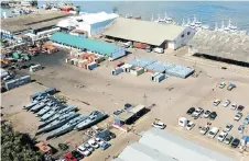  ?? Picture: AFP ?? IN DOCK: Fishing boats of the hastily created Ematum company and speedboats of Mozambican state company ProIndicus lie on a quay in Maputo. The money Maputo raised was supposedly to buy a fleet of tuna fishing boats but most of it seems to have been...