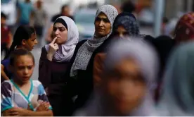  ?? Mohammed Salem/Reuters ?? Palestinia­ns wait in line to buy bread in Khan Younis in the southern Gaza Strip. Photograph: