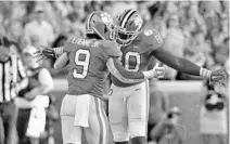  ?? RICHARD SHIRO/AP ?? Clemson’s Travis Etienne (9) celebrates with Milan Richard after scoring a touchdown against North Carolina State.