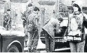  ?? (Photo: AP) ?? A man displays a picture of Irish Republican Army hunger-striker Bobby Sands, who dies this day at Maze Prison in Northern Ireland on his 66th day without food.