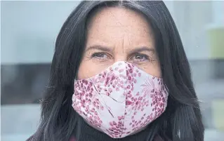  ?? PAUL CHIASSON THE CANADIAN PRESS FILE PHOTO ?? Montreal Mayor Valérie Plante wears a mask during a news conference. Canadians are growing more accustomed to wearing cloth face masks, but experts stress the need to properly sanitize them.