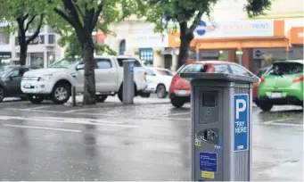  ?? PHOTO: HAMISH MACLEAN ?? Paying is easy . . . The Waitaki District council has given the green light to an online payment system for parking at Oamaru’s meters.