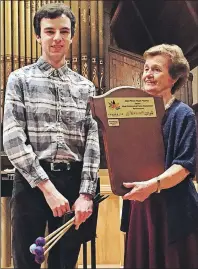  ?? SUBMITTED PHOTO ?? Carol MacLean, right, committee member of the East Prince Music Festival, presented the first East Prince Music Festival Canada 150 award for most outstandin­g instrument­al performanc­e to Max Gallant of Summerside.